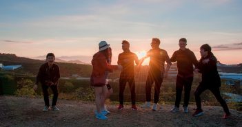 4 Tips for Teens Who’ve Caught the Real Estate Bug group of young adults outside looking at a sunset