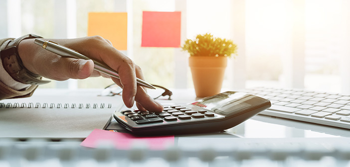 Close up view of bookkeeper or financial inspector hands making report, calculating or checking balance. Home finances, investment, economy, saving money or insurance concept