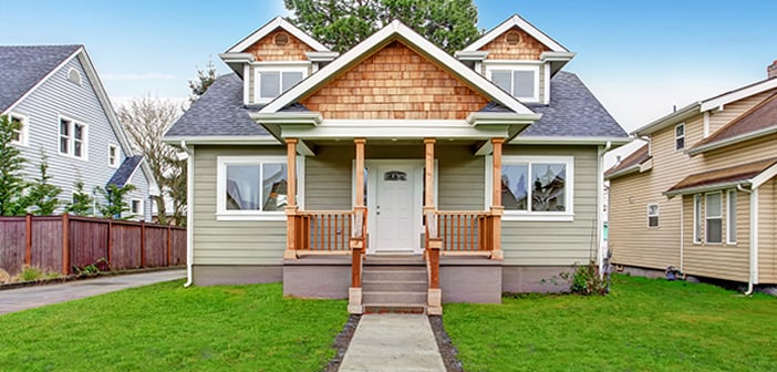 Small house exterior. View of entrance porch with stairs and walkway