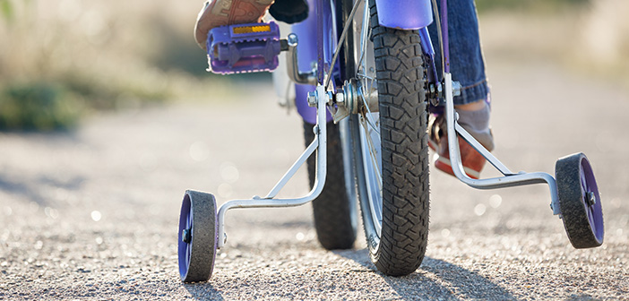 Kids bike with training wheels closeup