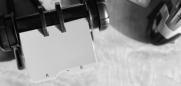 rolodex contact information spindle on desktop in black and white