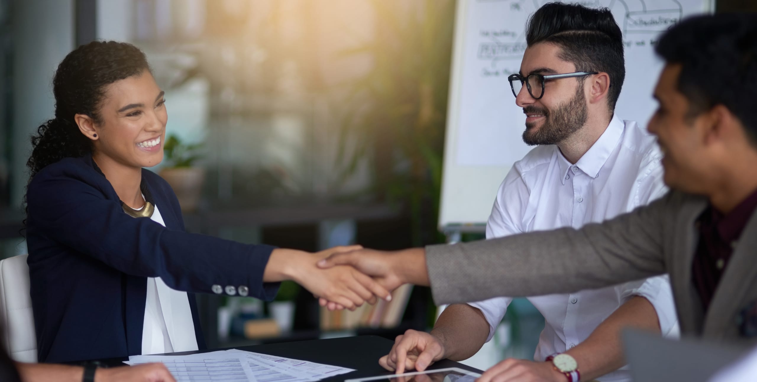 team members shaking hands