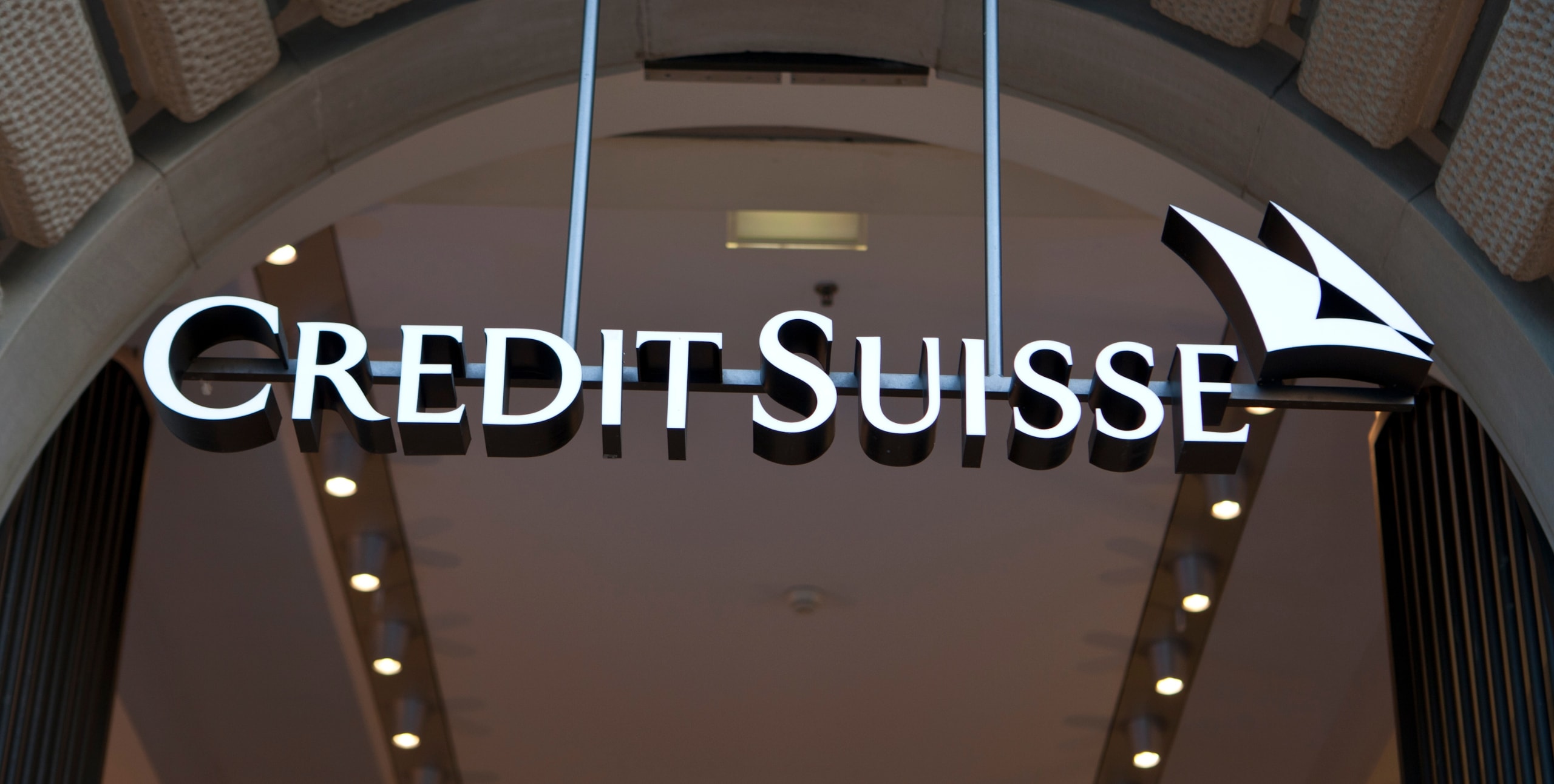 credit suisse logo in front of bank