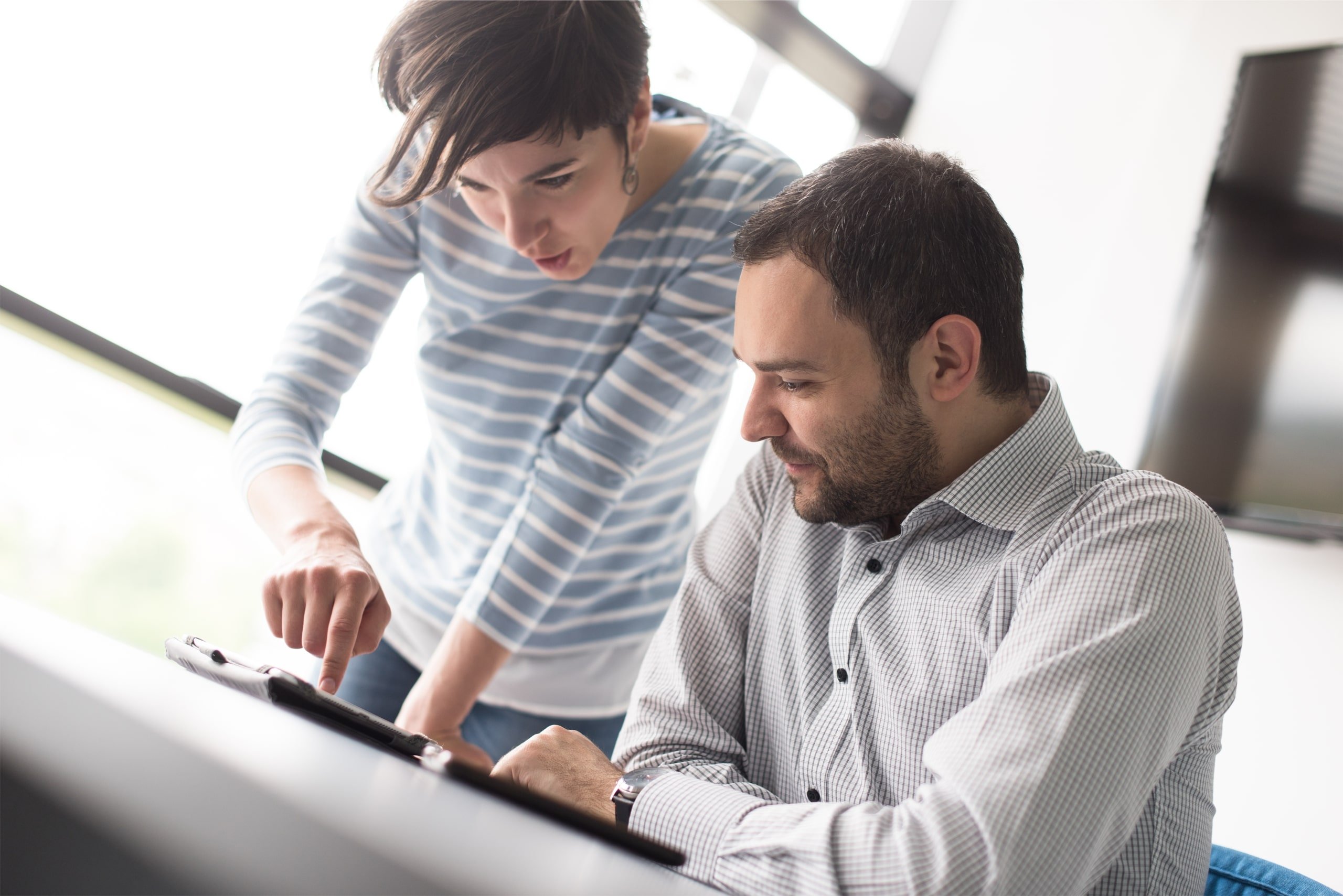 two people looking over paperwork about DSCR loans