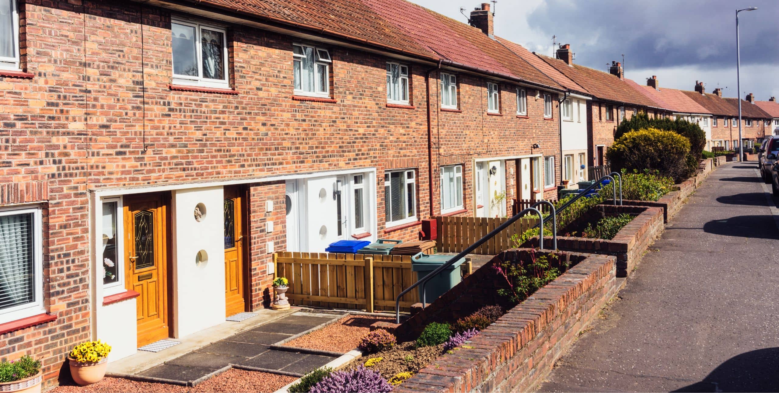 Investing in a Fourplex: Pros, Cons, & Tips For Investors
