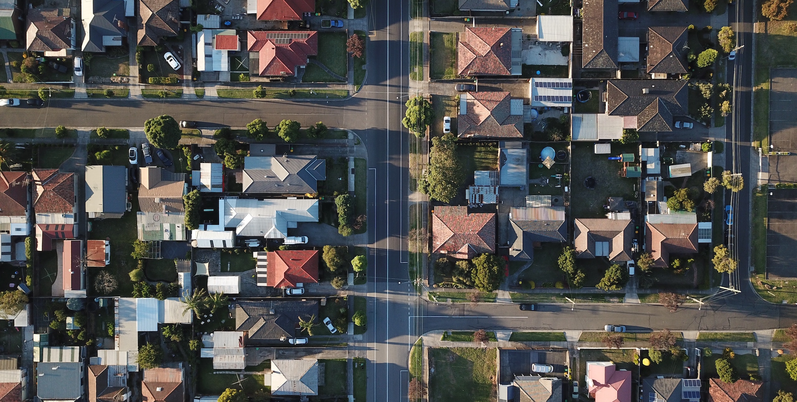 aerial of homes to show how to learn about real estate investing