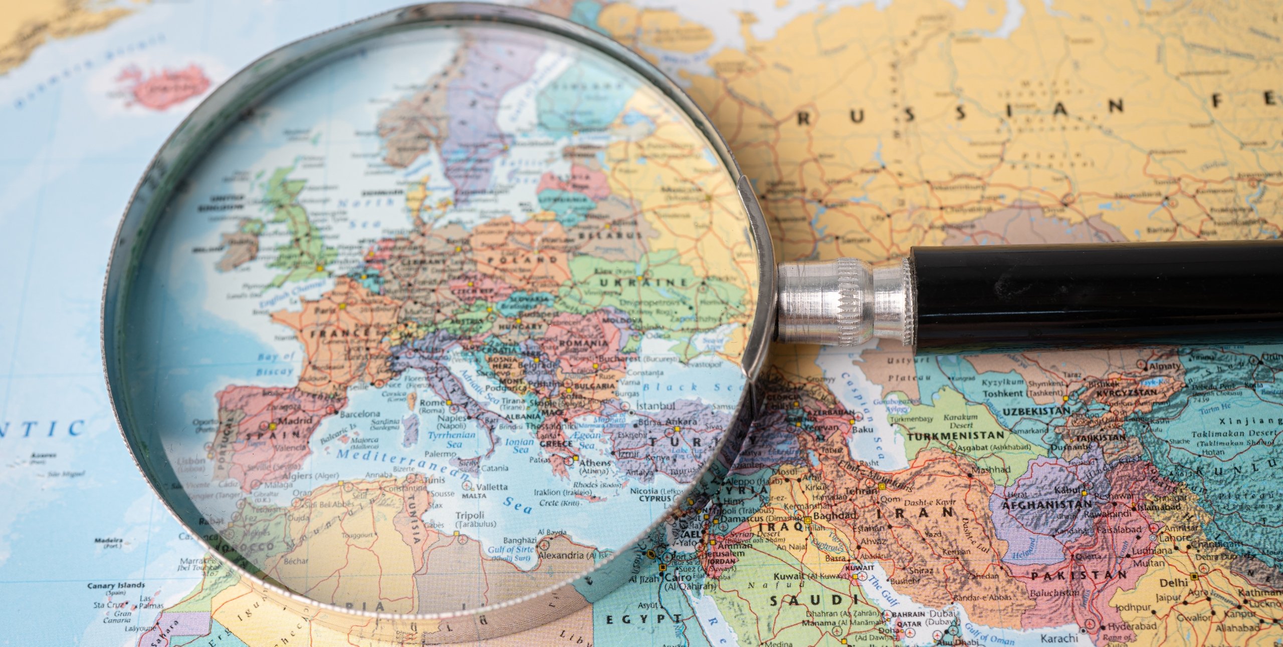 magnifying glass over a map of europe