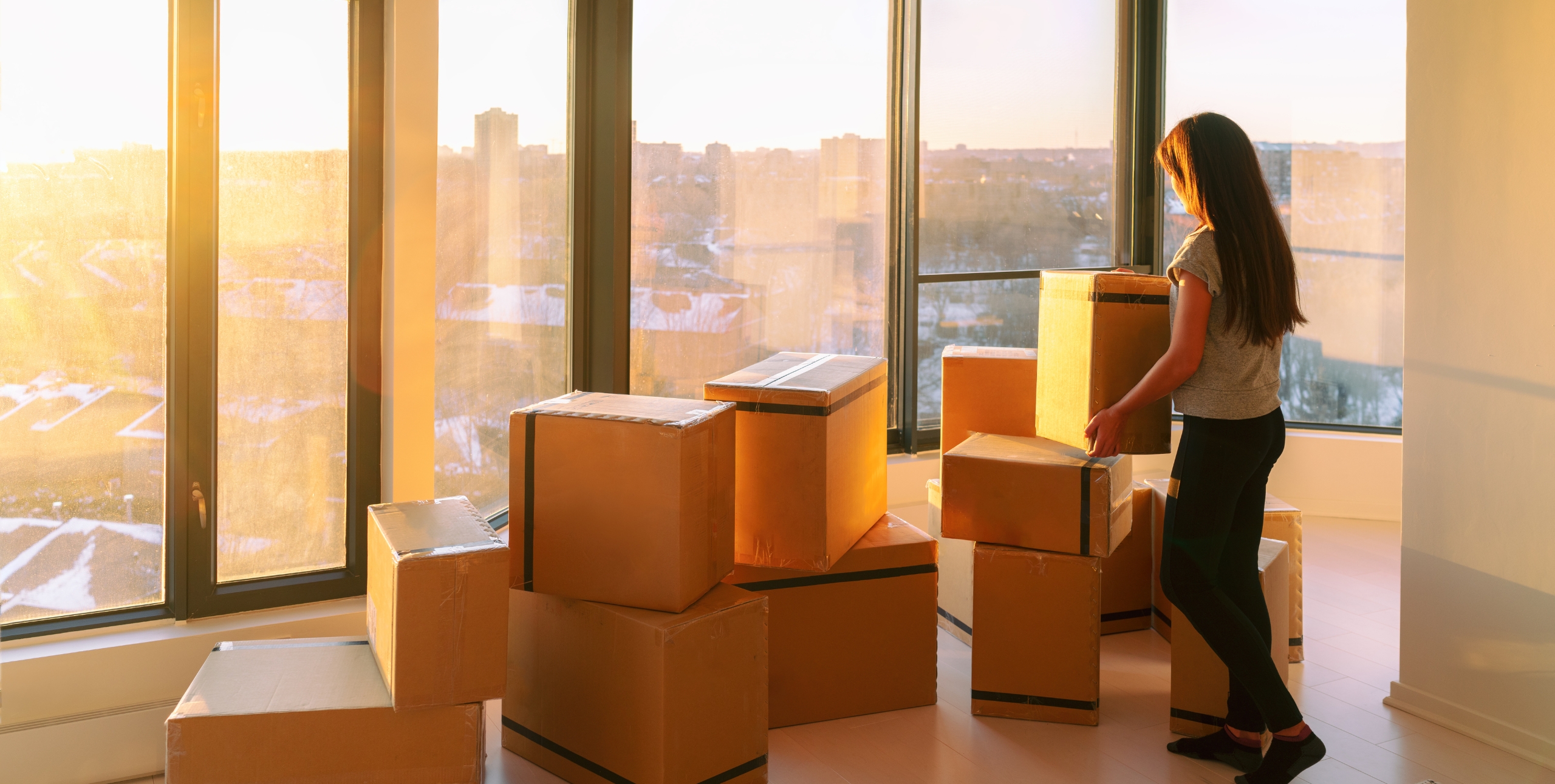 tenant unpacking boxes for a house hack