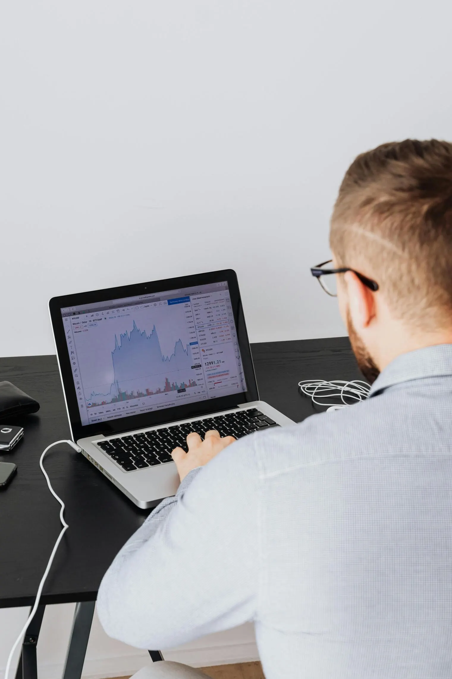 An investor searching for an agent on a laptop